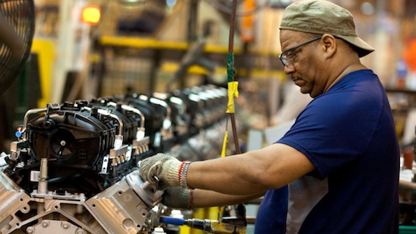 A worker at the Romulus Powertrain plant in Michigan