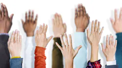 A variety of raised hands