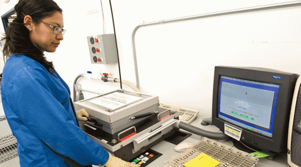 A Firstronic employee conducts an in-circuit test of electronic assemblies.