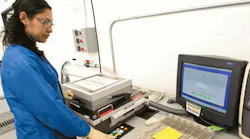 A Firstronic employee conducts an incircuit test of electronic assemblies