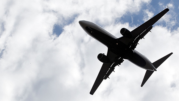 A plane flies through the sky