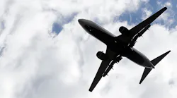 A plane flies through the sky
