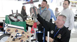 Guests participate in a bike build training simulation to teach workplace organization skills