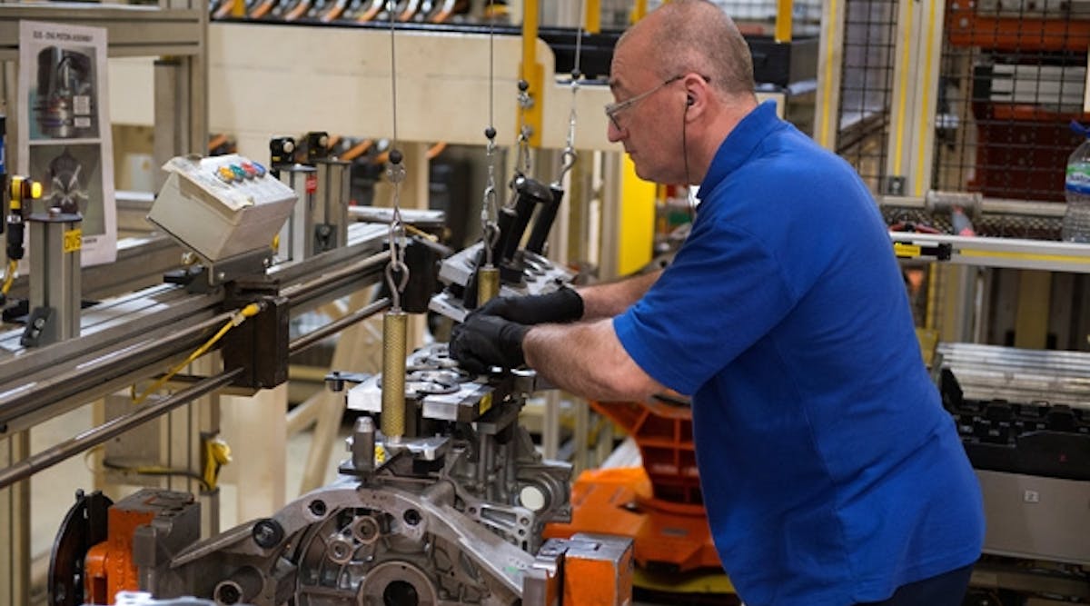 An employee at Ford&apos;s Dagenham, England, facility works on assembly of a diesel engine. Ford designs and engineers gasoline and diesel engines in the U.K. that go into half of all Ford vehicles.