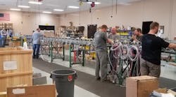 Workers assemble product at Aladdin Light Lift&apos;s manufacturing facility in Huntsville, Alabama.