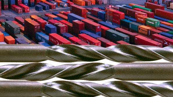 Shipping containers and drills set against each other