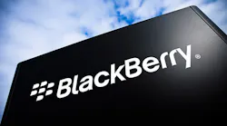 The BlackBerry wordmark on a black sign against a cloudy sky