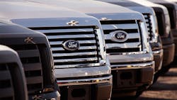 A row of Ford trucks in a lot A row of Ford trucks in a lot