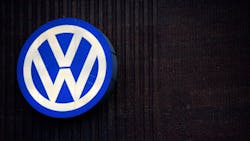 The Volkswagen logo on the side of a building The Volkswagen logo on the side of a building