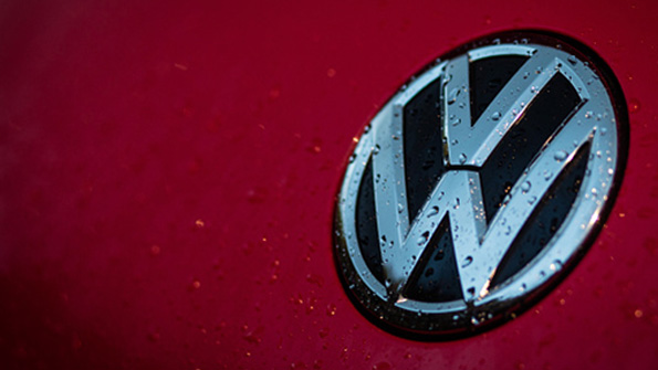 The VW logo on a car hood