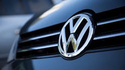 A Volkswaegn logo on a car grille A Volkswaegn logo on a car grille