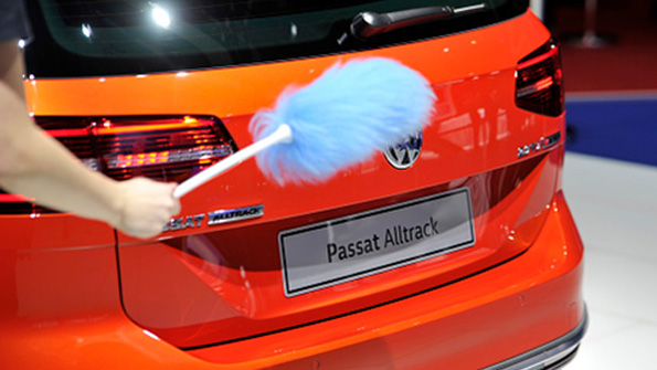 A VW Passat is cleaned at the Geneva Auto Show