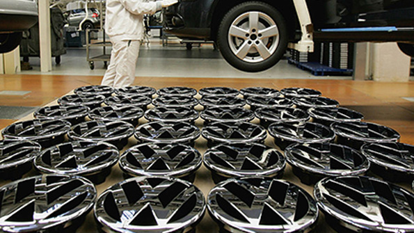 VW hood ornaments wait to be attached to cars at the Wolfsburg plant