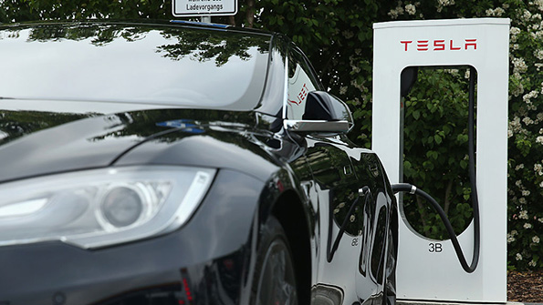 A Tesla vehicle charges at a station in Germany