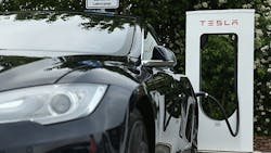 A Tesla vehicle charges at a station in Germany A Tesla vehicle charges at a station in Germany