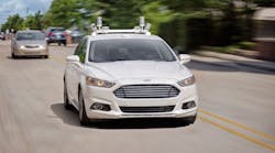 A fully autonomous Ford Fusion hybrid makes an appearance on a Michigan street.