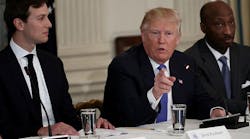 U.S. President Donald Trump speaks during a meeting with manufacturing CEOs in the State Dining Room of the White House February 23, 2017, in Washington. To the right is Kenneth Frazier, CEO of Merck &amp; Co.