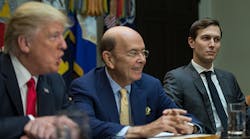 Commerce secretary Wilbur Ross, center, flanked by President Donald Trump and his senior adviser, Jared Kushner.