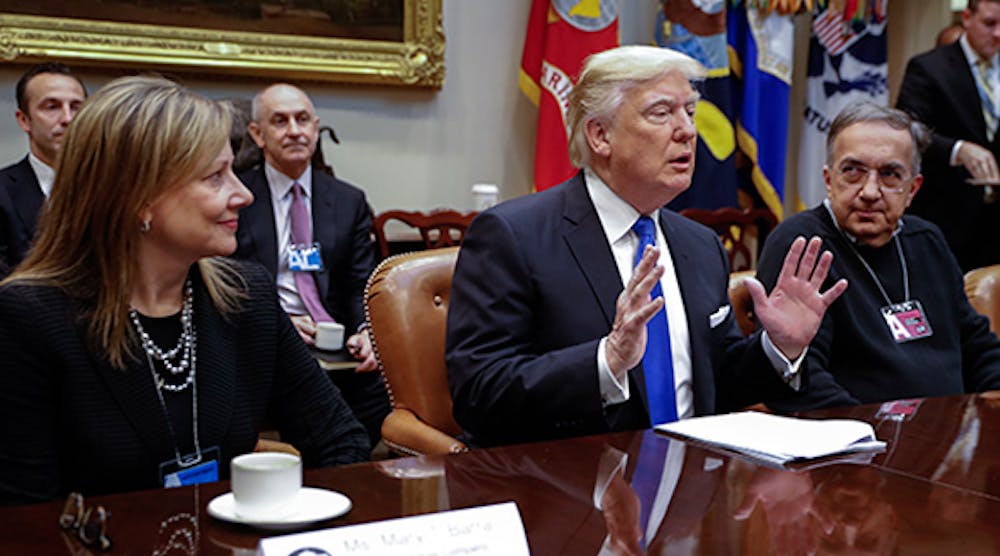 President Donald Trump is flanked by GM CEO Mary Barra, left, and FCA CEO Sergio Marchionne during a meeting held the first week of his presidency.