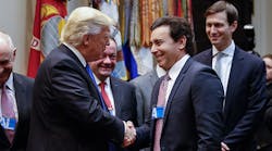 President Donald Trump shakes hands with Ford Motor Company CEO Mark Fields after a January group meeting in the Roosevelt Room in the White House.