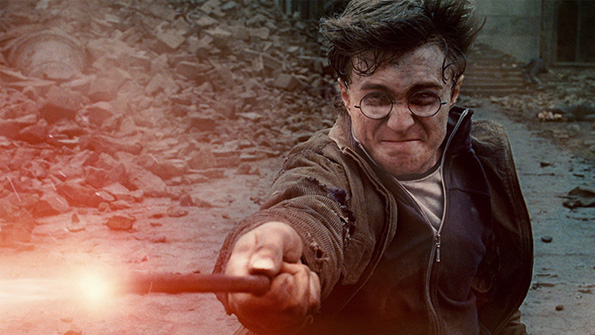 Daniel Radcliffe wields a wand as Harry Potter