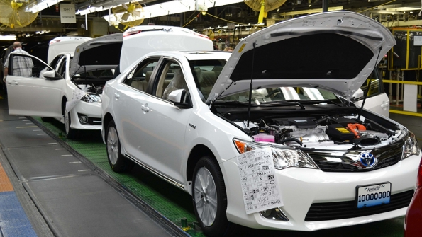The 10 millionth vehicle assembled at Toyota Motor Manufacturing Kentucky Inc a Camry Hybrid rolls down the line in May 2014