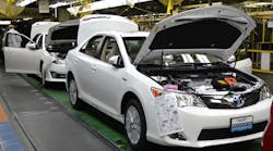 The 10 millionth vehicle assembled at Toyota Motor Manufacturing, Kentucky, Inc., a Camry Hybrid, rolls down the line in May 2014.