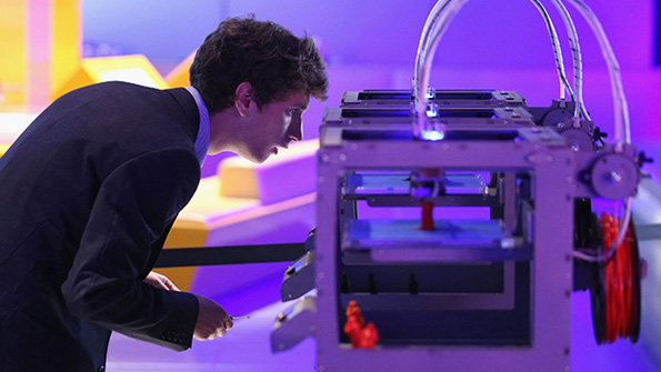 A technician checks on a 3D printer at the Science Museum in London