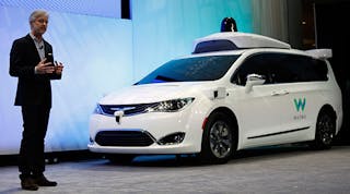 Waymo CEO John Krafcik debuts a customized Chrysler Pacifica hybrid at the North American International Auto Show earlier this year in Detroit.