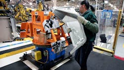 woman assembler at US manufacturing factory woman assembler at US manufacturing factory