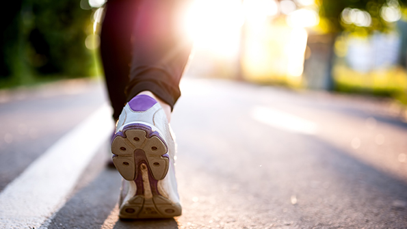closeup of mans feet walking
