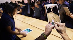 Attendees at Apple&apos;s WWDC event try out the new ARKit on the iPhone and iPad.