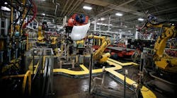 Robots handle parts for Fiat Chrysler automobiles at the FCA Sterling Stamping Plant in Sterling Heights, Mich. A new study asserts that a border adjustment tax and a U.S. withdrawal from NAFTA could negatively impact car prices, vehicle sales, supply chain decisions and employment in the U.S. automotive industry.