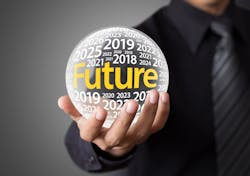 Person holding fortune tellers ball with years printed on its surface Person holding fortune tellers ball with years printed on its surface