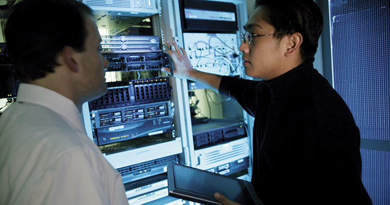 Two men looking at server