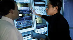 Two men looking at server