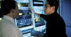 Two men looking at server Two men looking at server