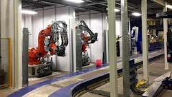 The second station of Romeo RIM's new automated, robotic LFI press. The second station of Romeo RIM's new automated, robotic LFI press.