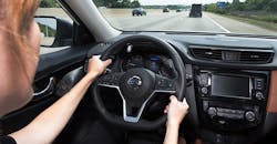 Woman with hands on steering wheel Woman with hands on steering wheel