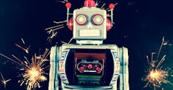 An old-school toy robot, in front some sparks. An old-school toy robot, in front some sparks.