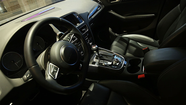 The interior of an Audi Q5 SUV following the car's return from a 3,500-mile cross-country trip, a first for a driverless vehicle. Auto supplier Delphi Automotive Plc designed the car.