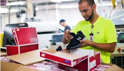 Worker at New Balance Factory Worker at New Balance Factory