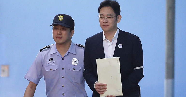 police with Samsung's Lee Jae-Yong