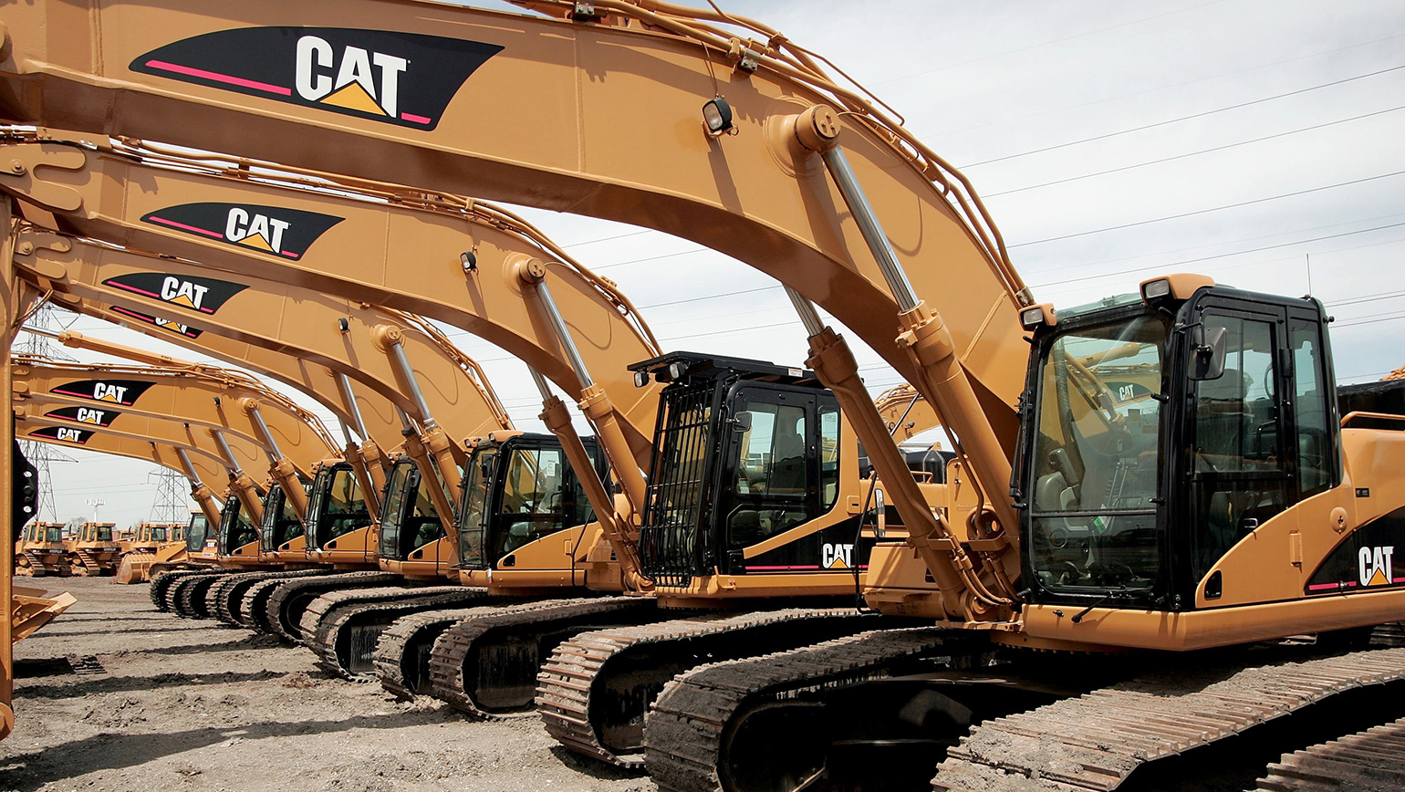A row of Caterpillar excavators