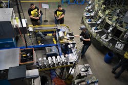 KEEN's Portland factory in action: humans to the left, injection molding to the right. KEEN's Portland factory in action: humans to the left, injection molding to the right.