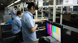 China workers assembling TVs