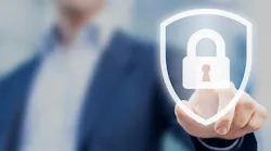 A man in a sportcoat holds up his finger to press a superimposed image of a lock in a shield.