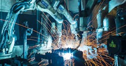 Robots welding in car factory Robots welding in car factory