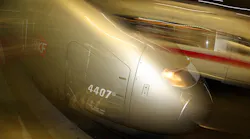A high-speed TGV train hurtles into a station in Germany.