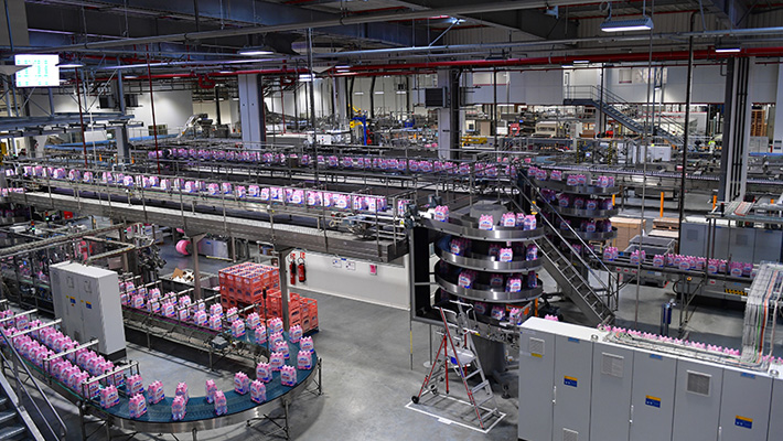 Six-packs of bottled water run along the lines at an Evian plant in France.